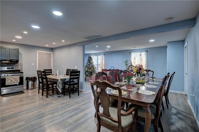 dining space featuring light hardwood / wood-style floors