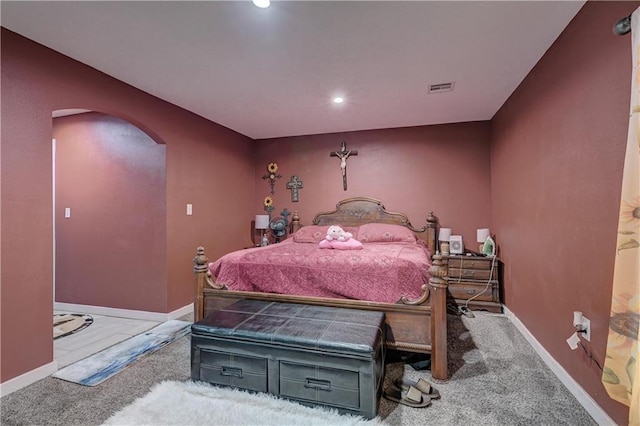 bedroom featuring light colored carpet