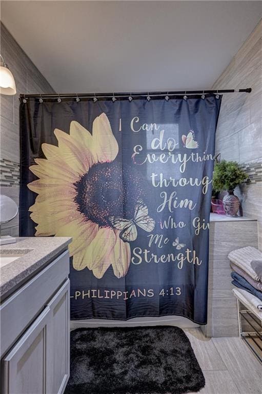 bathroom with vanity and walk in shower