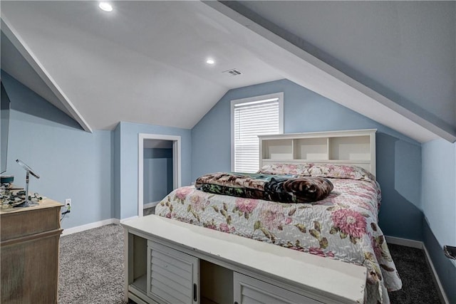 carpeted bedroom with lofted ceiling