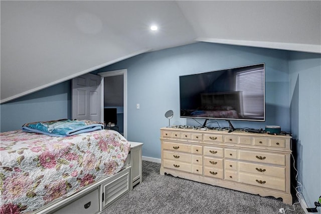 carpeted bedroom with lofted ceiling