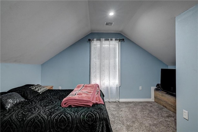 carpeted bedroom featuring lofted ceiling