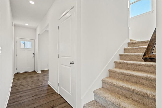 staircase featuring hardwood / wood-style flooring