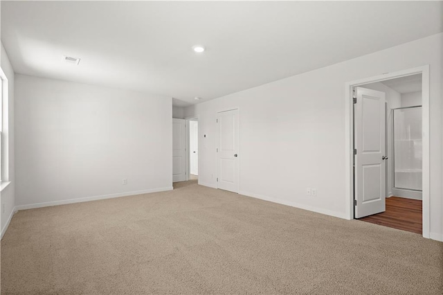 spare room featuring carpet