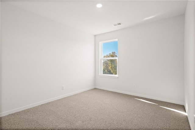 empty room featuring carpet flooring