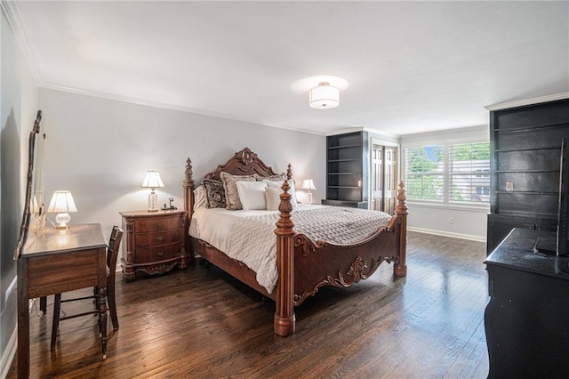 bedroom with wood finished floors, ornamental molding, and baseboards