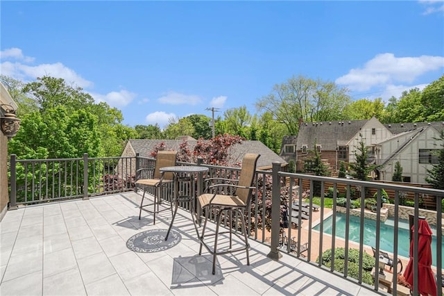 view of patio featuring a balcony