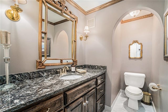 821 W 54th Ter, Kansas City, MO 64112 - half bathroom featuring vanity, marble look tile flooring, and crown molding
