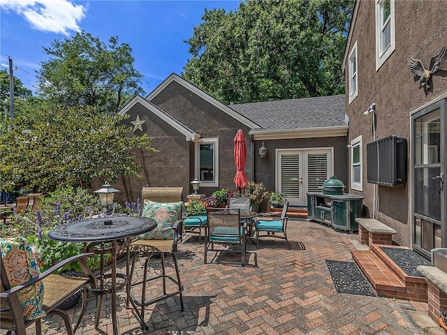 821 W 54th Ter, Kansas City, MO 64112 - view of patio featuring outdoor dining space and french doors
