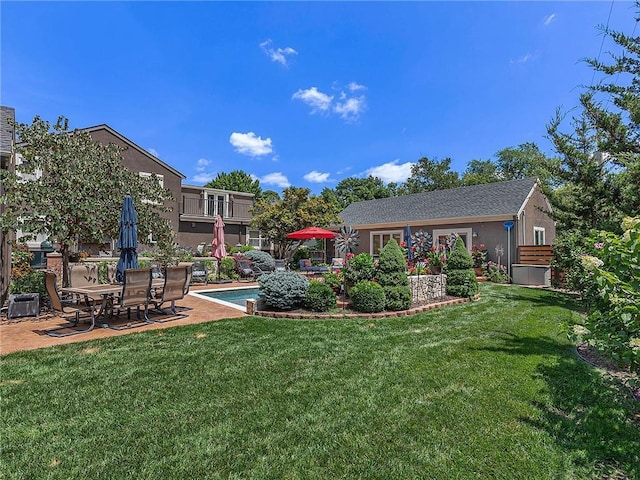 821 W 54th Ter, Kansas City, MO 64112 - view of green lawn with a patio area and an outdoor pool