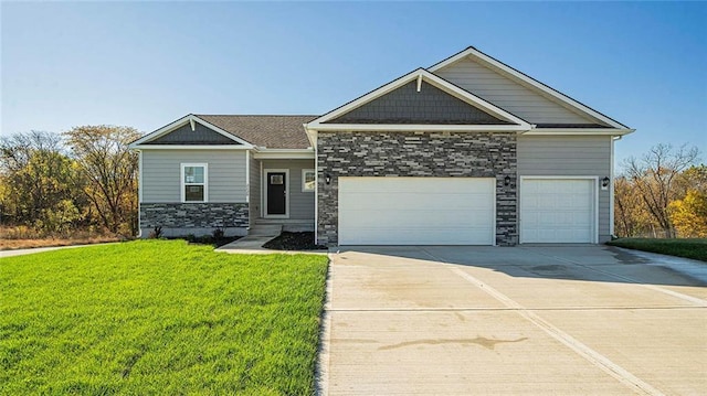 craftsman house with a garage and a front yard