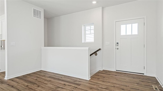 entrance foyer featuring dark hardwood / wood-style flooring