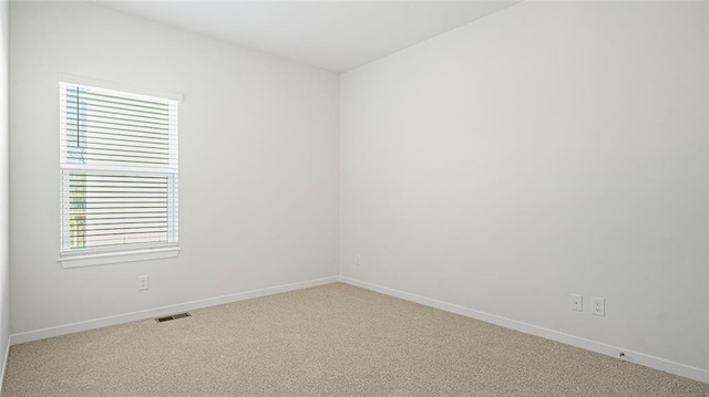 spare room featuring carpet flooring