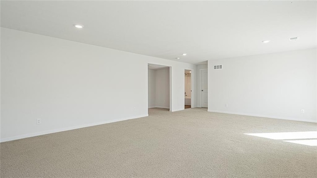 spare room with light carpet