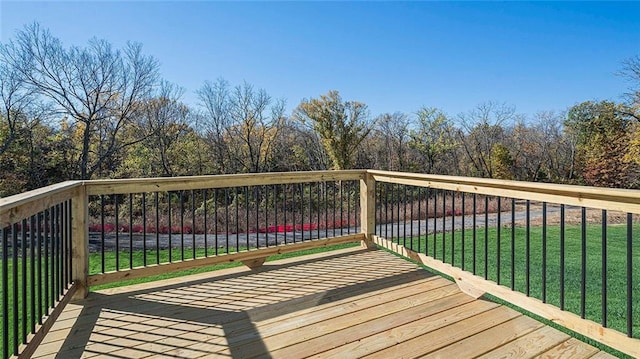 wooden terrace with a yard