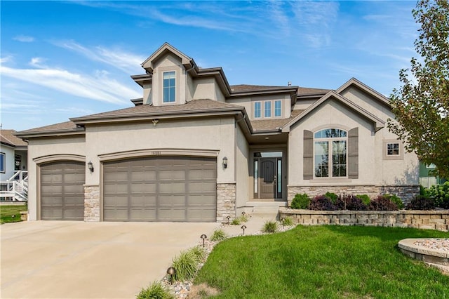 view of front of house with a garage and a front lawn