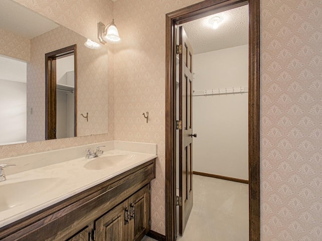 bathroom featuring vanity and a textured ceiling