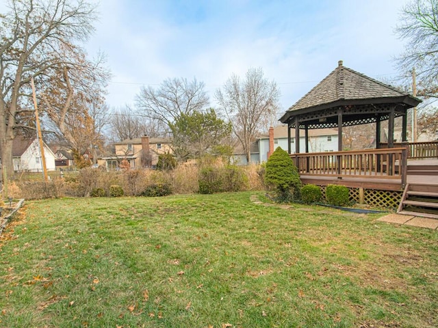 view of yard featuring a gazebo and a wooden deck