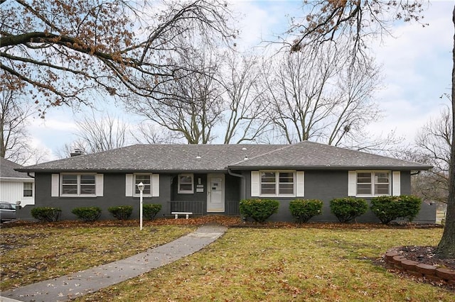 single story home featuring a front yard