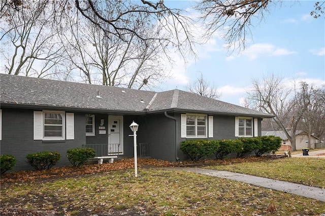 ranch-style house with a front lawn