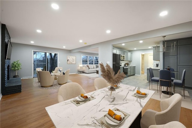 dining area featuring light wood-type flooring