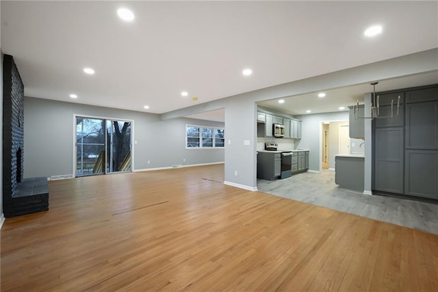 unfurnished living room with light hardwood / wood-style flooring