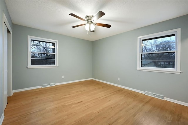 unfurnished bedroom with light hardwood / wood-style flooring and ceiling fan