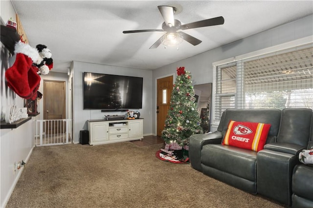 living room featuring carpet flooring and ceiling fan