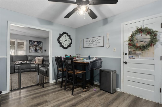 dining space featuring dark hardwood / wood-style floors and ceiling fan