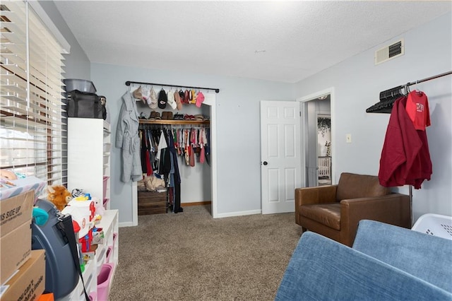 carpeted bedroom featuring a closet