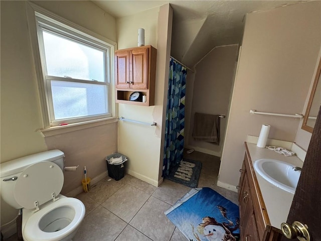 bathroom featuring tile patterned floors, vanity, a shower with shower curtain, and toilet