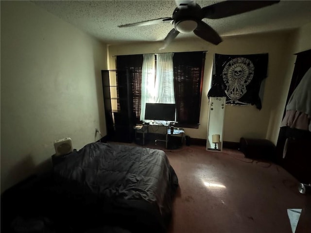 bedroom featuring a textured ceiling, carpet floors, and ceiling fan