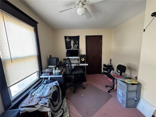 office with carpet flooring, a textured ceiling, and ceiling fan