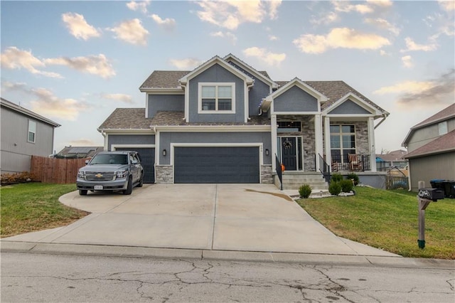 craftsman-style house featuring a garage and a front yard