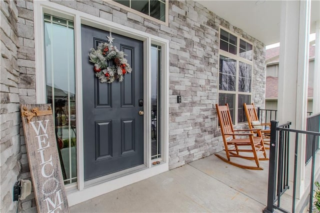 doorway to property featuring covered porch