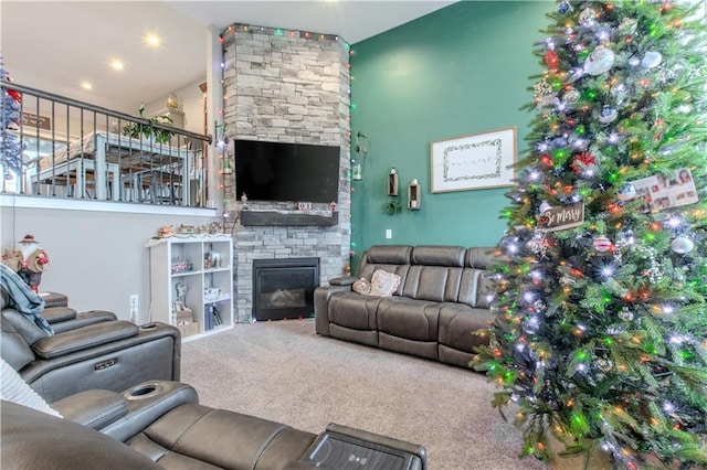 living room featuring a fireplace and carpet