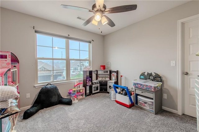 recreation room featuring ceiling fan and carpet floors