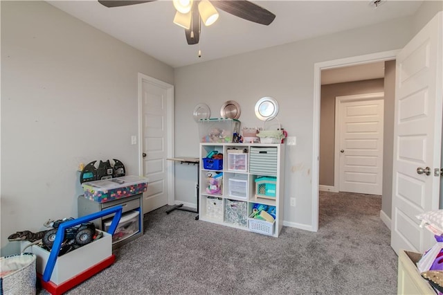 playroom with carpet and ceiling fan