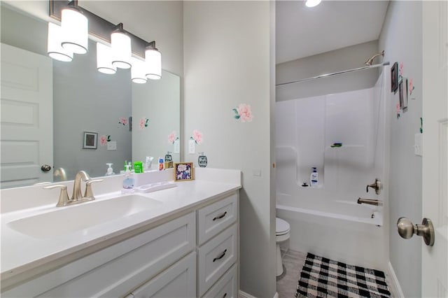 full bathroom with toilet, vanity, and washtub / shower combination