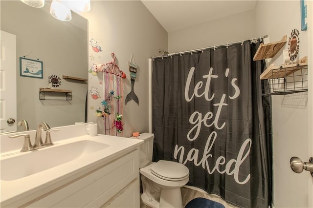 bathroom featuring a shower with curtain, vanity, and toilet