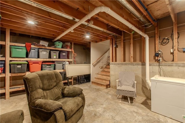 sitting room featuring concrete flooring