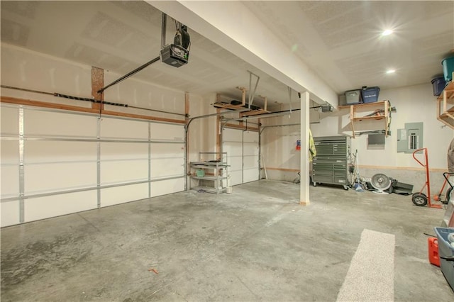 garage featuring a garage door opener and electric panel