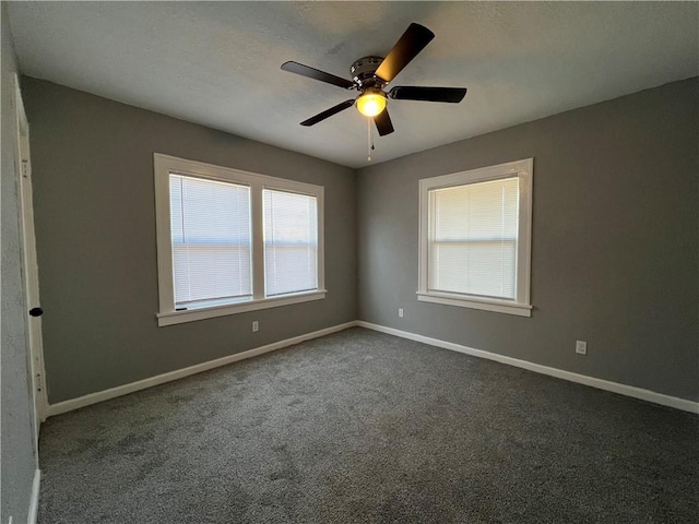 empty room with carpet floors and ceiling fan