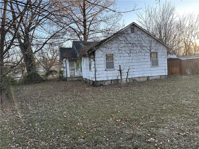 view of property exterior at dusk