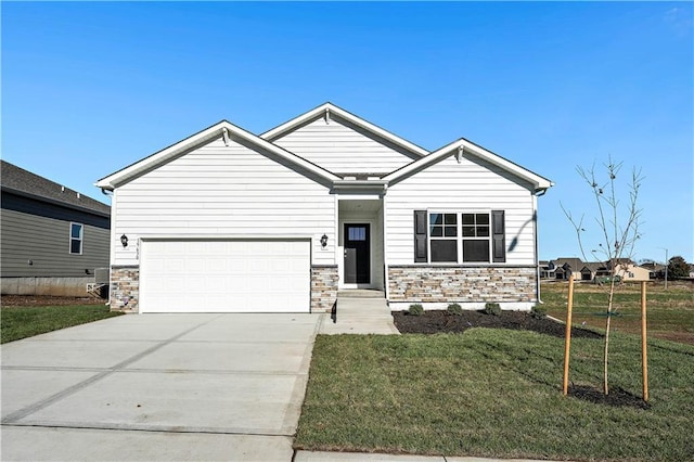 craftsman-style home with a garage and a front lawn