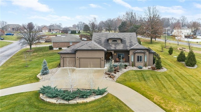 view of front of home with a front lawn and a garage