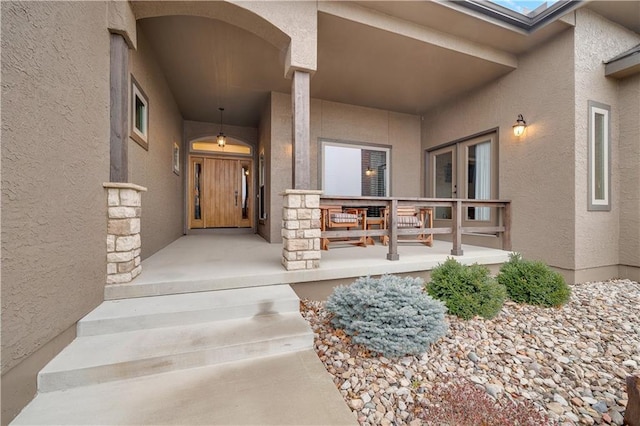 property entrance with covered porch