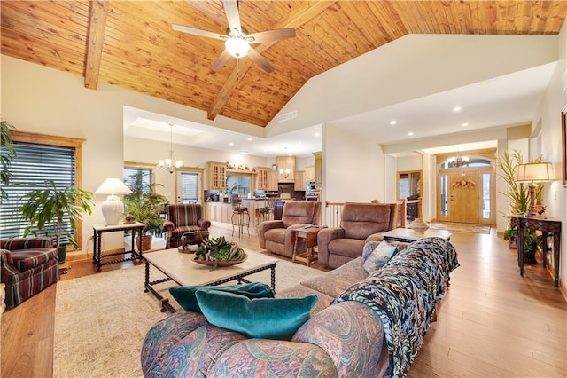 living room featuring ceiling fan with notable chandelier, light hardwood / wood-style floors, high vaulted ceiling, and wooden ceiling