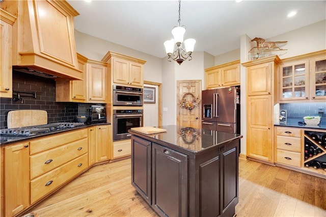 kitchen featuring pendant lighting, decorative backsplash, light wood-type flooring, a notable chandelier, and stainless steel appliances