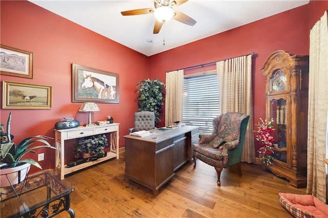 home office featuring ceiling fan and light hardwood / wood-style flooring